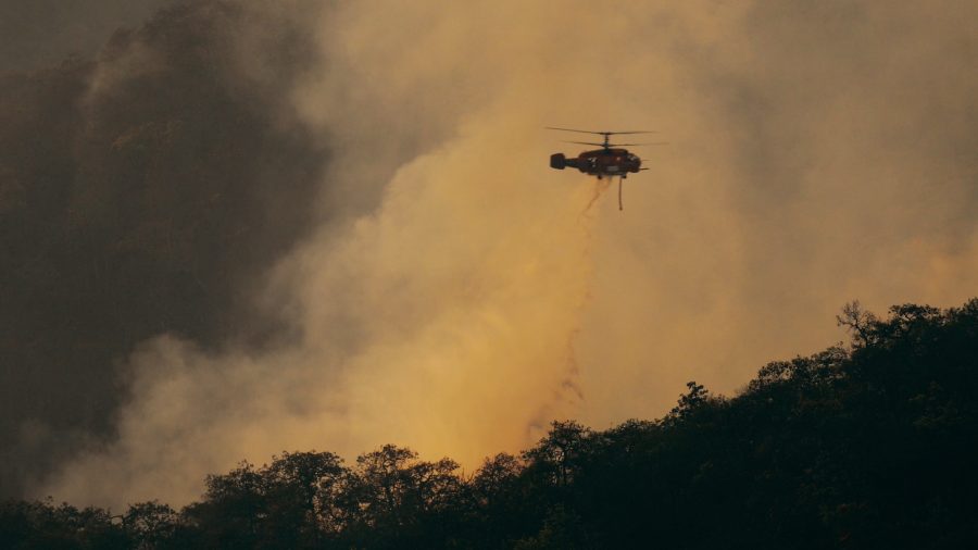 Helicopter putting out a wildfire.