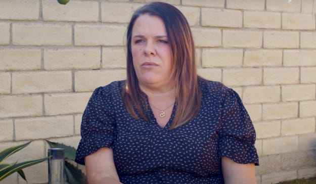 A woman is sitting and giving a testimonial about how good the Watts Trial Firm is. Small picture