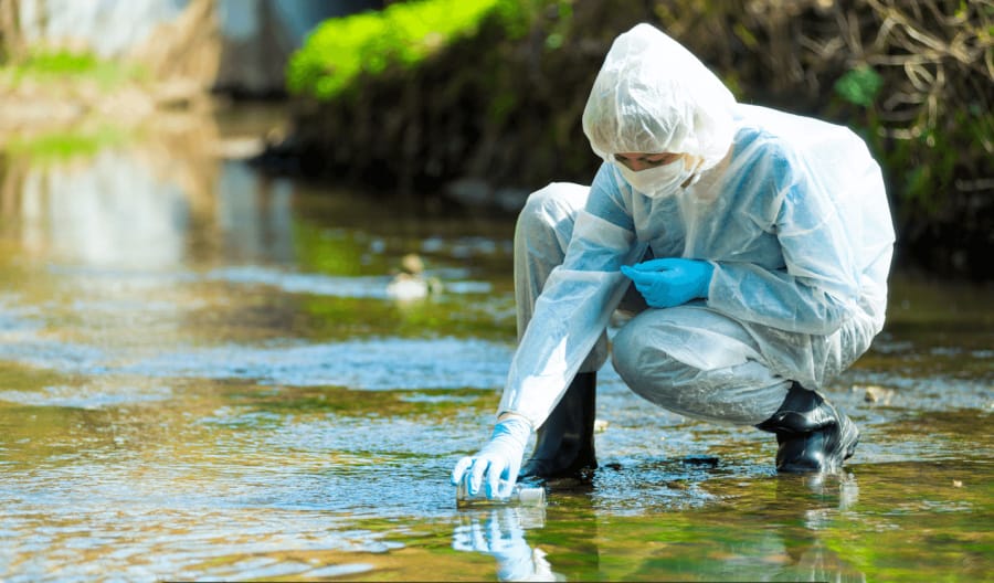 Professional taking samples of water.