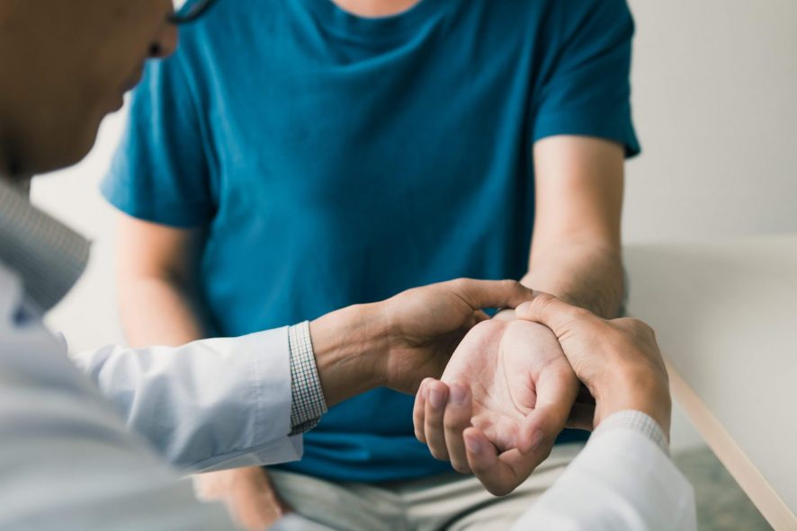 A doctor is checking a patient.
