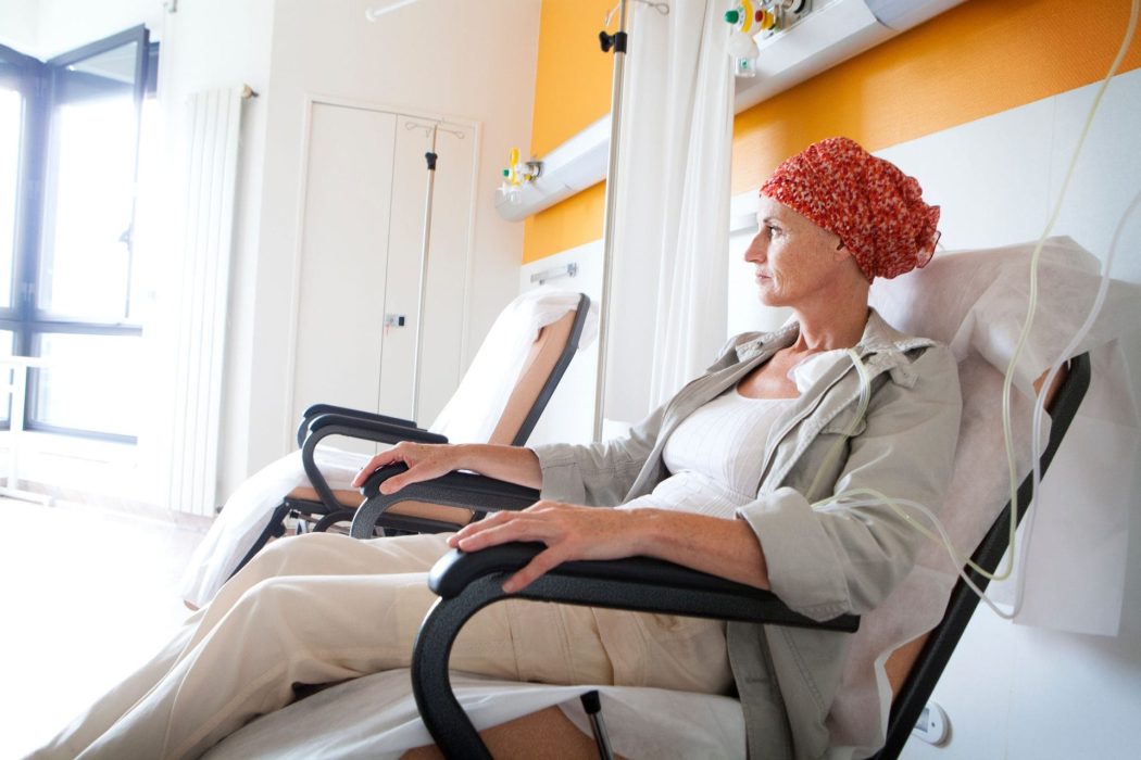 woman in hospital taking chemo treatment